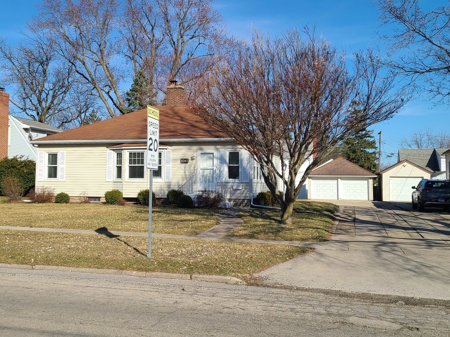 1045 North 9th Street Rochelle, IL 61068 - Photo 1 of 27 a front view of a house with a yard and garage