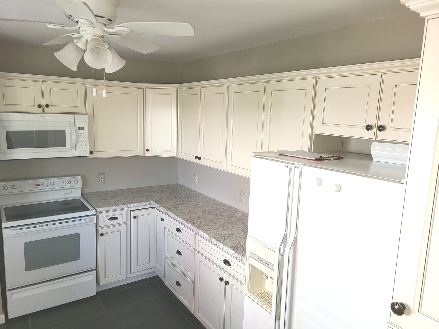 1045 North 9th Street Rochelle, IL 61068 - Photo 12 of 27 a kitchen with granite countertop white cabinets and white appliances