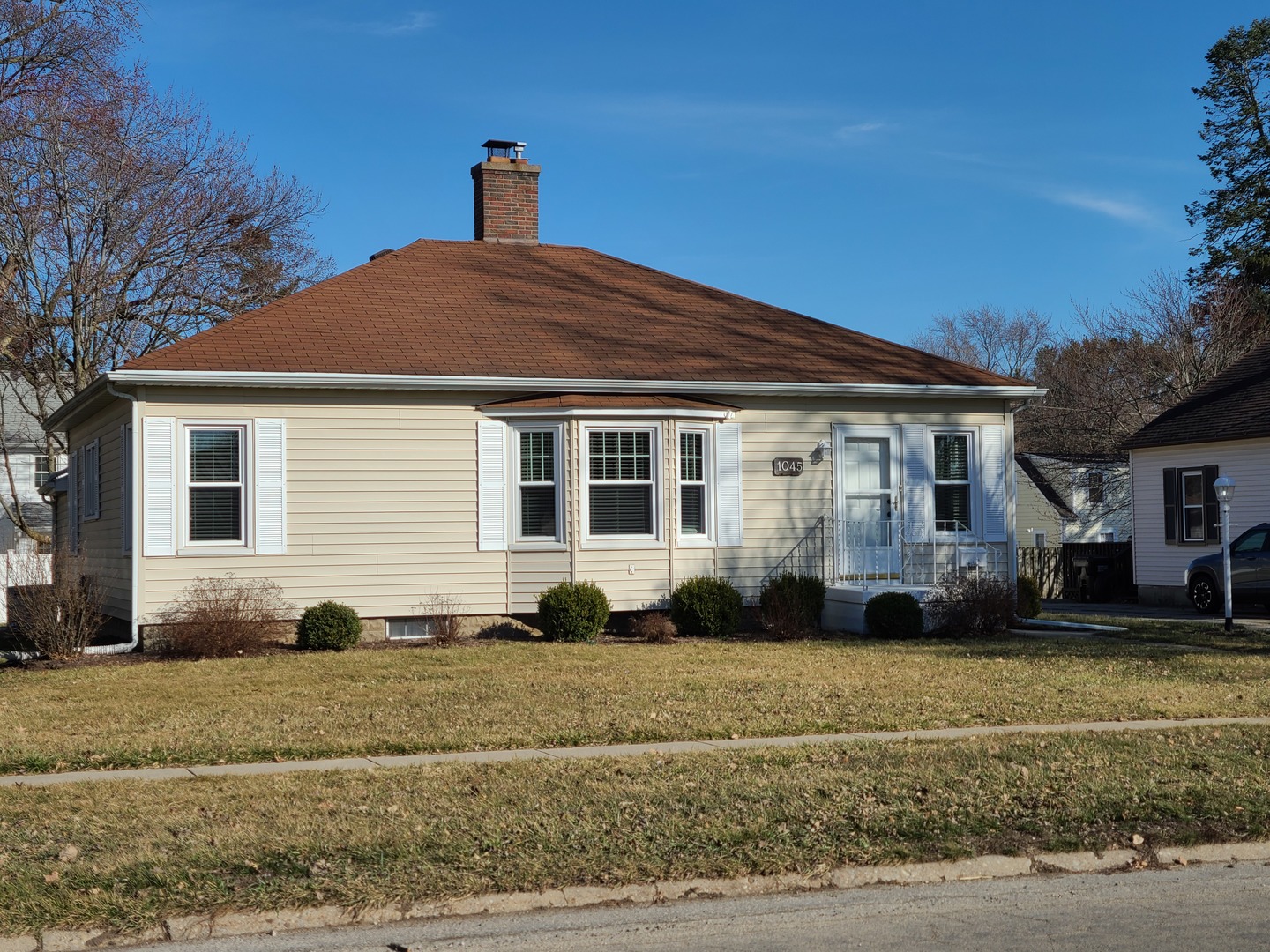 1045 North 9th Street Rochelle, IL 61068 - Photo 3 of 27 a front view of a house with a yard