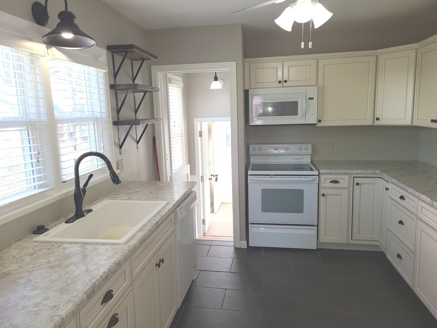 1045 North 9th Street Rochelle, IL 61068 - Photo 8 of 27 a kitchen with white cabinets appliances and a sink