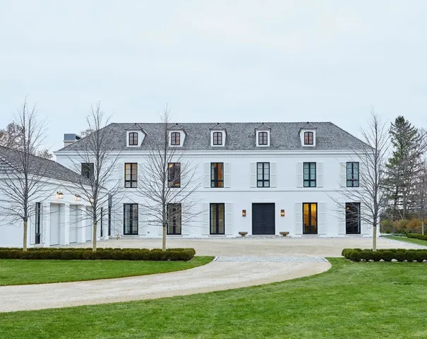 a front view of building with yard