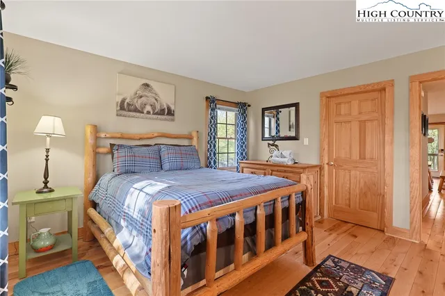 a bedroom with a bed and a table in it