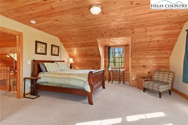 a bedroom with a bed and a chair