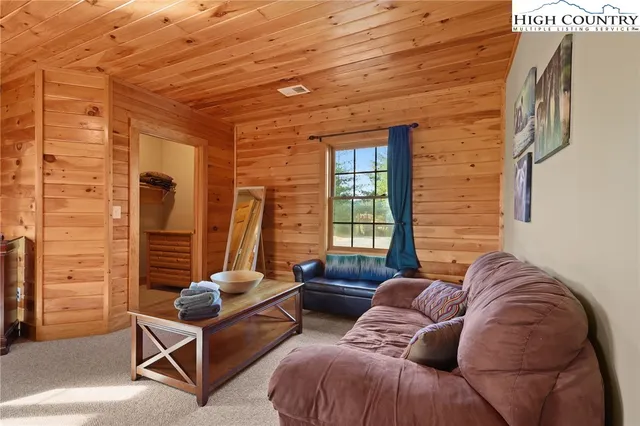 a bedroom with furniture and a window