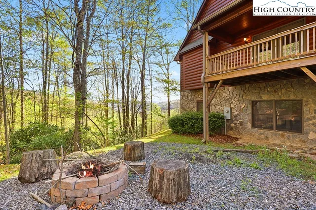 a view of a chair and table in backyard