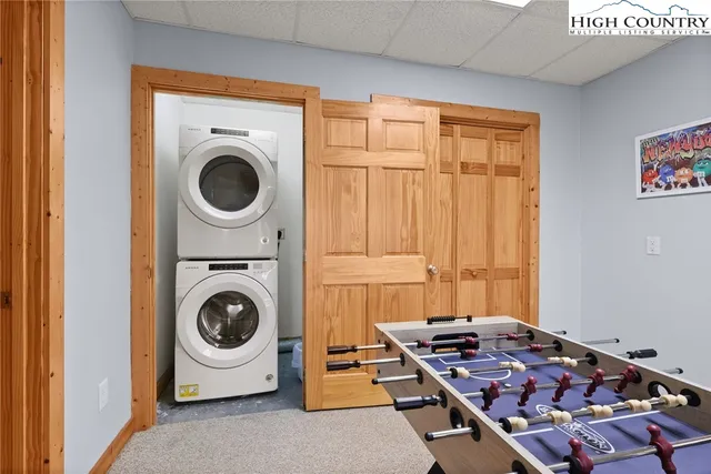 a utility room with sink dryer and washer