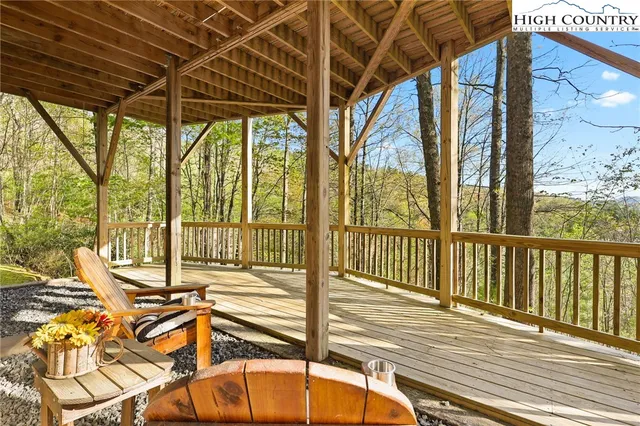 a view of a balcony with wooden floor