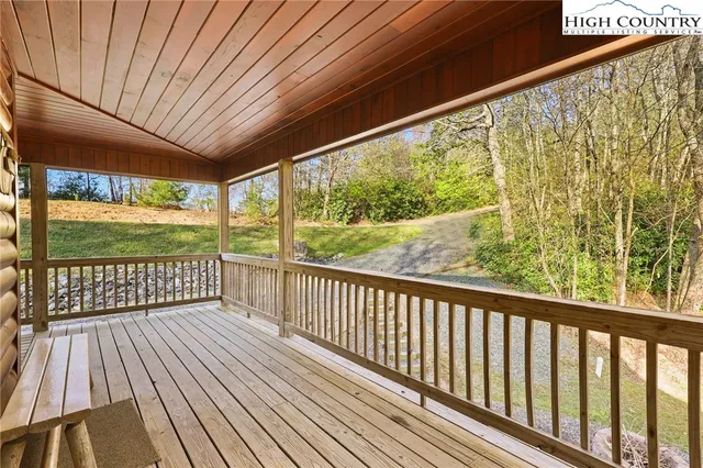 a view of a porch with wooden floor