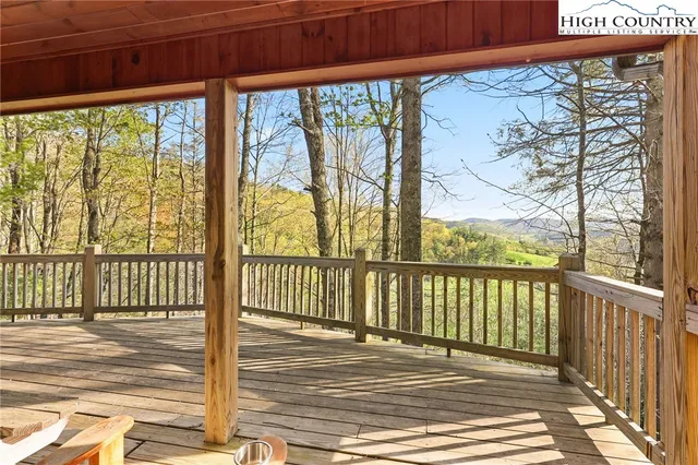 a view of a balcony with wooden floor