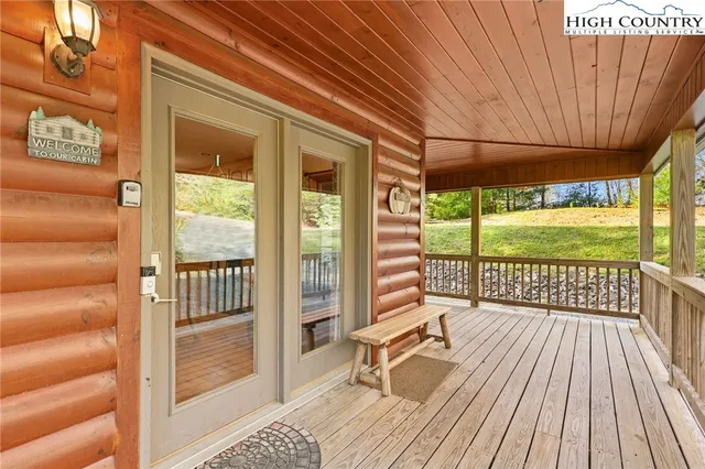 a view of a room with wooden floor and iron stairs