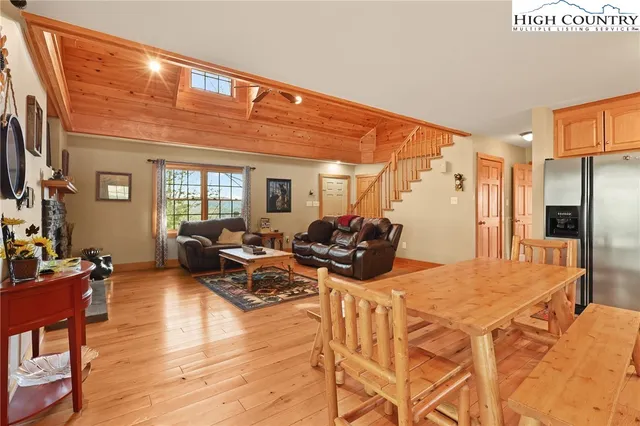 a living room with furniture window and wooden floor