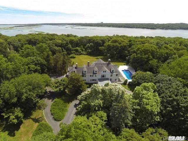 19 Stillwater Road Nissequogue, NY 11780 - Photo 1 of 1 an aerial view of a house with a garden and lake view