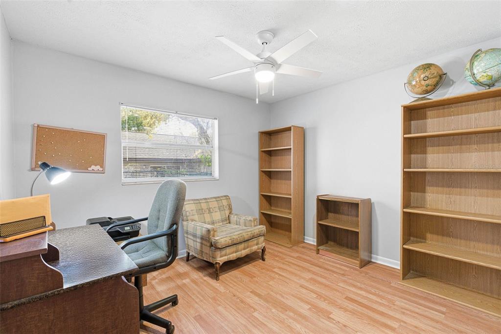 4120 East Temple Heights Road Tampa, FL 33617 - Photo 23 of 55 a living room with furniture and a wooden floor