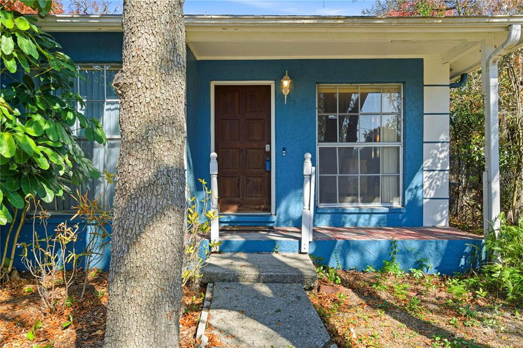 4120 East Temple Heights Road Tampa, FL 33617 - Photo 6 of 55 a front view of a house with a yard