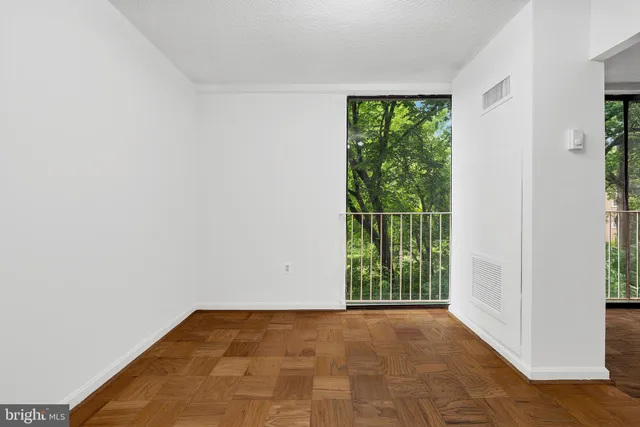 a view of an empty room with a window