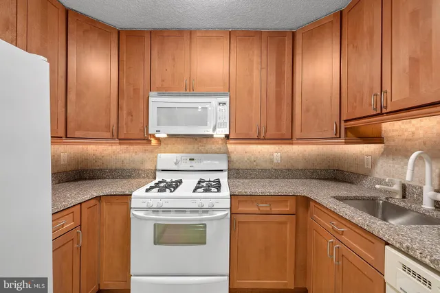 a kitchen with a stove and a microwave