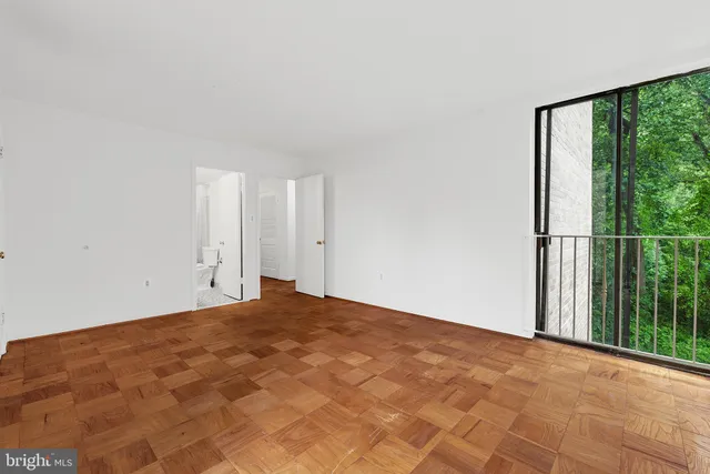 a view of an empty room with a window
