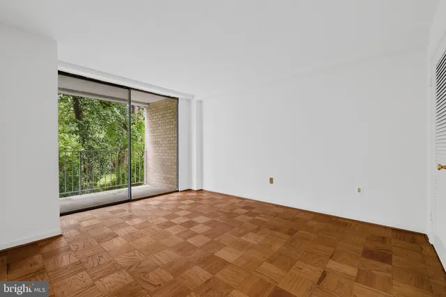 a view of an empty room with a large window