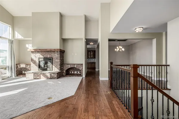 a view of a livingroom with furniture and a fireplace