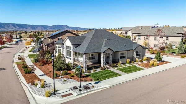 a front view of a house with sitting area