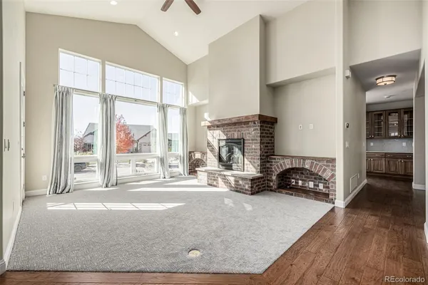a living room with furniture window and a fireplace