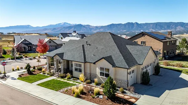 an aerial view of a house with a garden