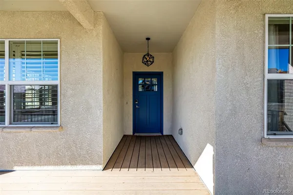 a view of a hallway view with wooden floor and a window