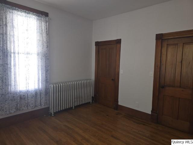 210 Main Street Carthage, IL 62321 - Photo 16 of 36 a view of a room with wooden floor and windows