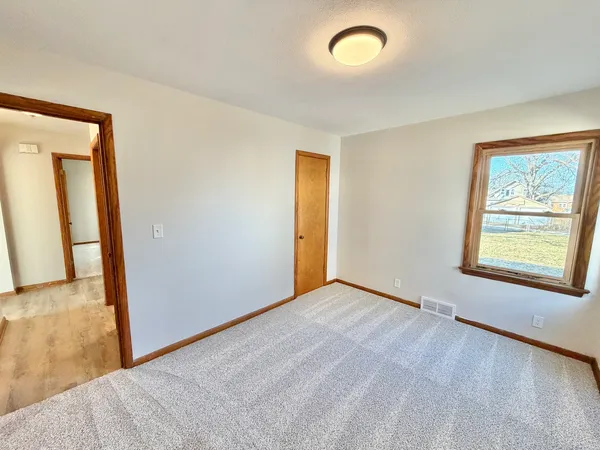 a view of an empty room and window