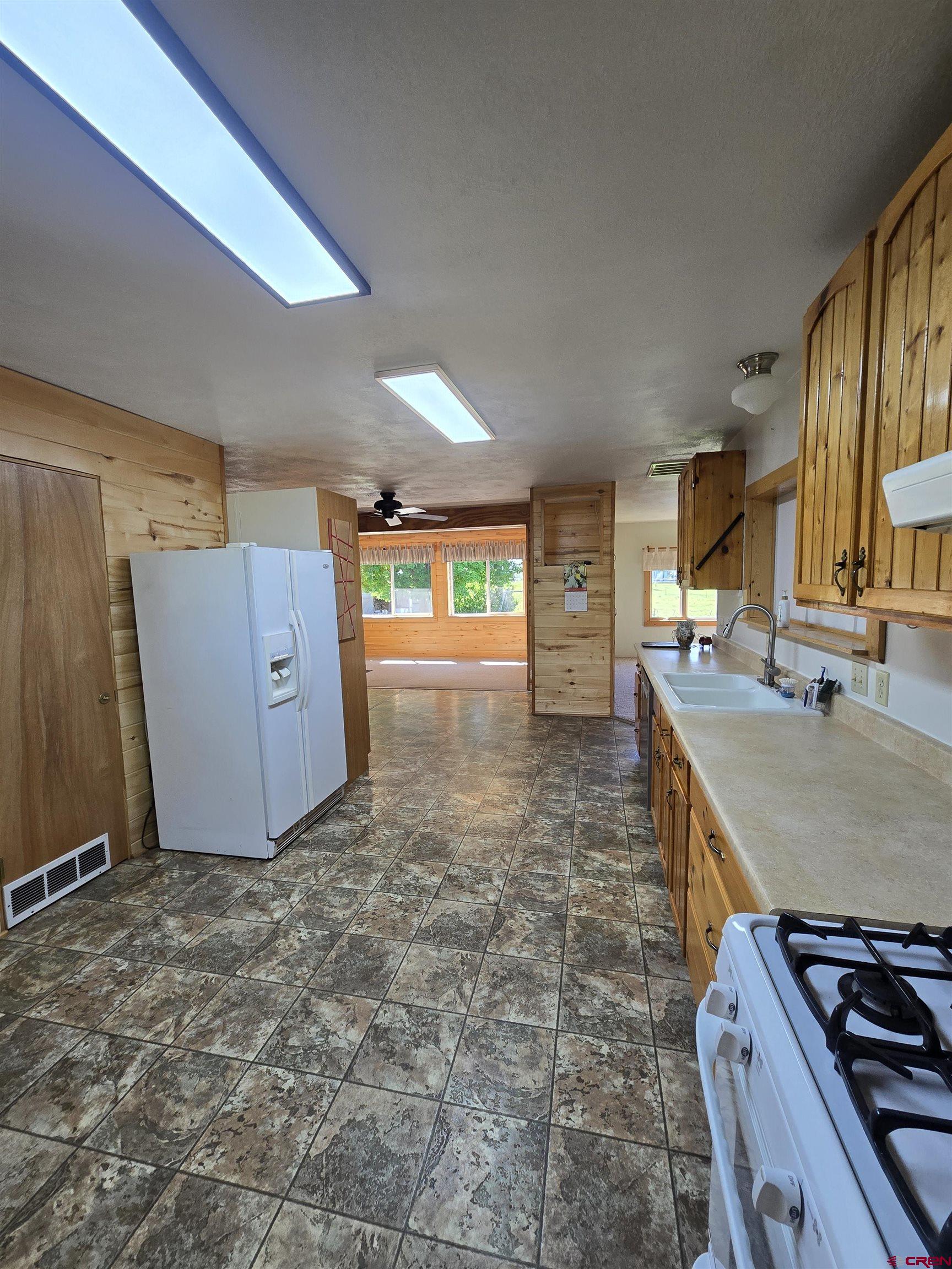 23435 County Rd M Cortez, CO 81321 - Photo 4 of 27 a view of a kitchen with a sink