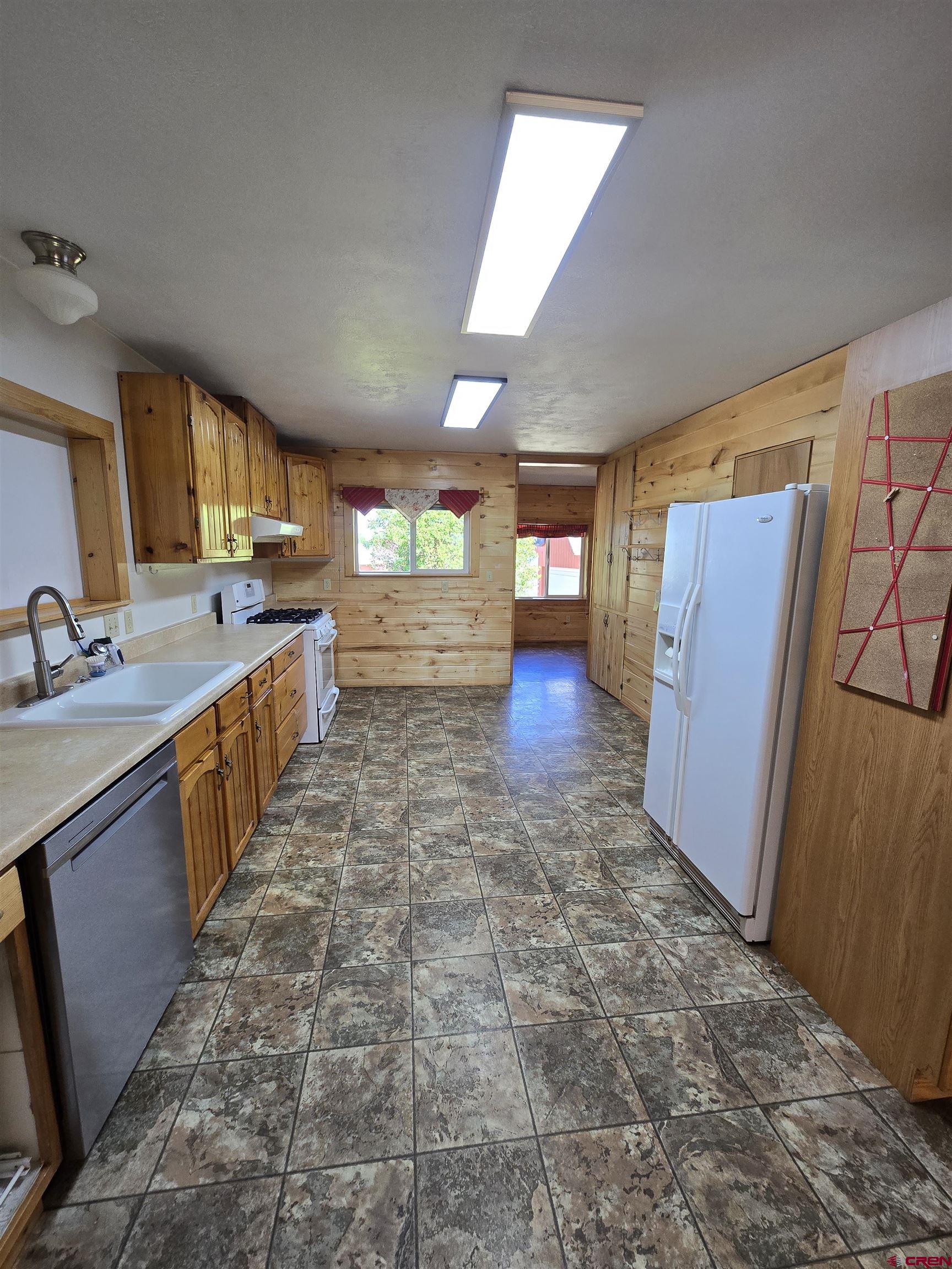 23435 County Rd M Cortez, CO 81321 - Photo 5 of 27 a large bathroom with a sink and a large mirror