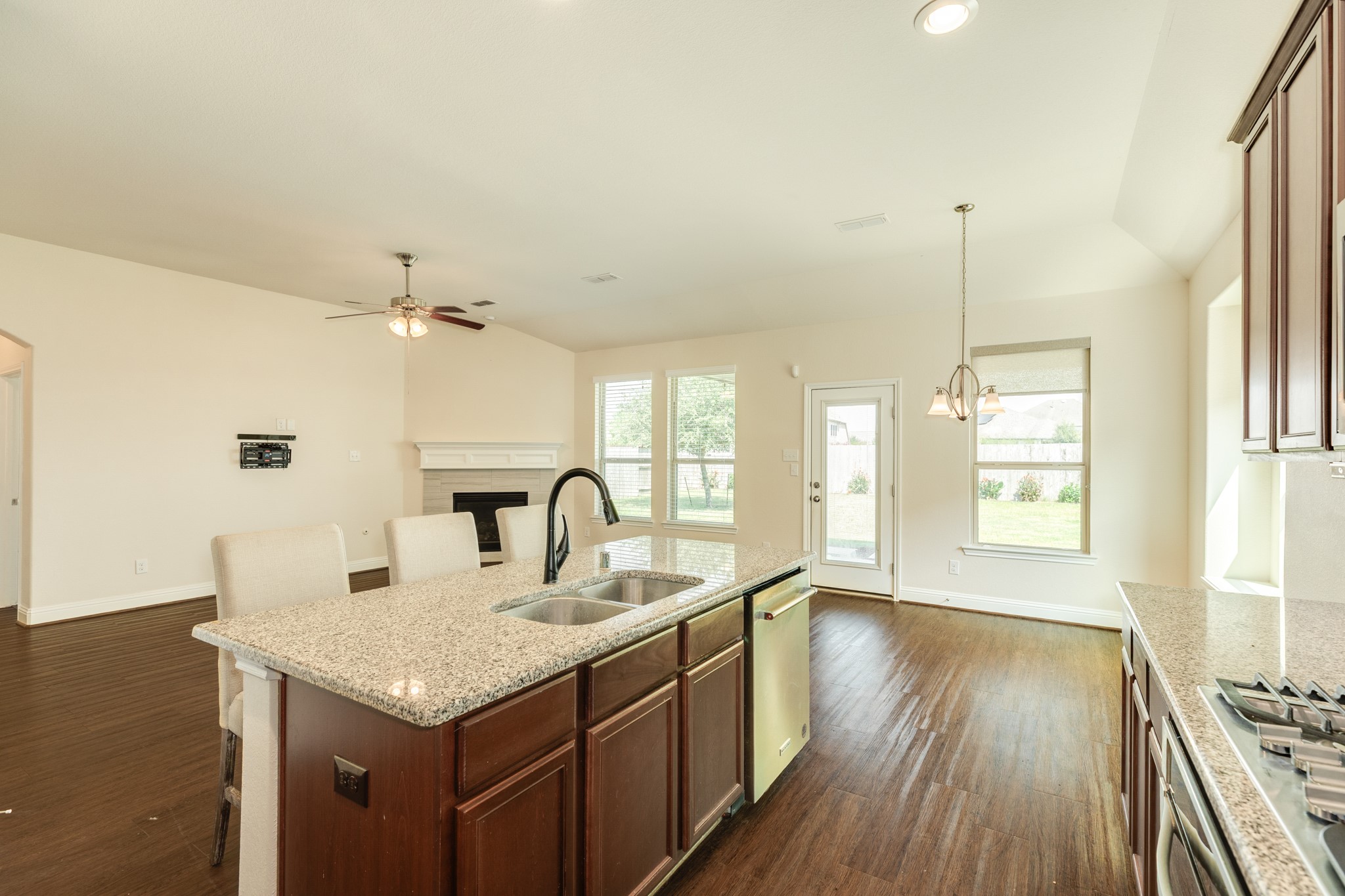 3519 Bay Drive Rosharon, TX 77583 - Photo 17 of 49 Bright and airy dining area surrounded by expansive windows, featuring a back door with an integrated hidden blind for adjustable privacy.
