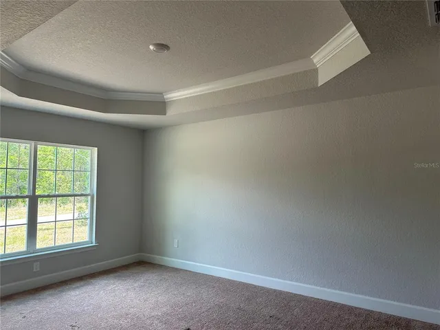 a view of an empty room with glass door