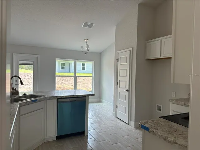 a view of a room with wooden walls