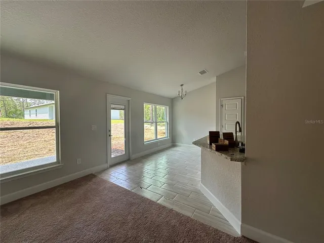 a view of a room with wooden walls