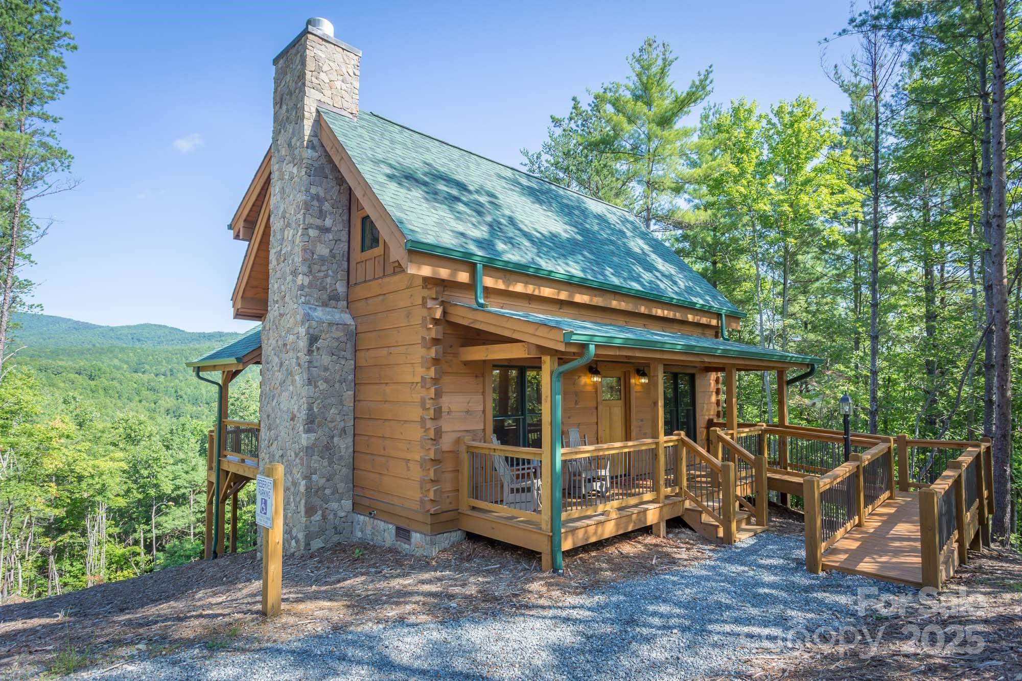 9587 Shortoff View Terrace, Unit 57 Nebo, NC 28761 - Photo 11 of 16 a view of a house with a yard balcony and outdoor seating