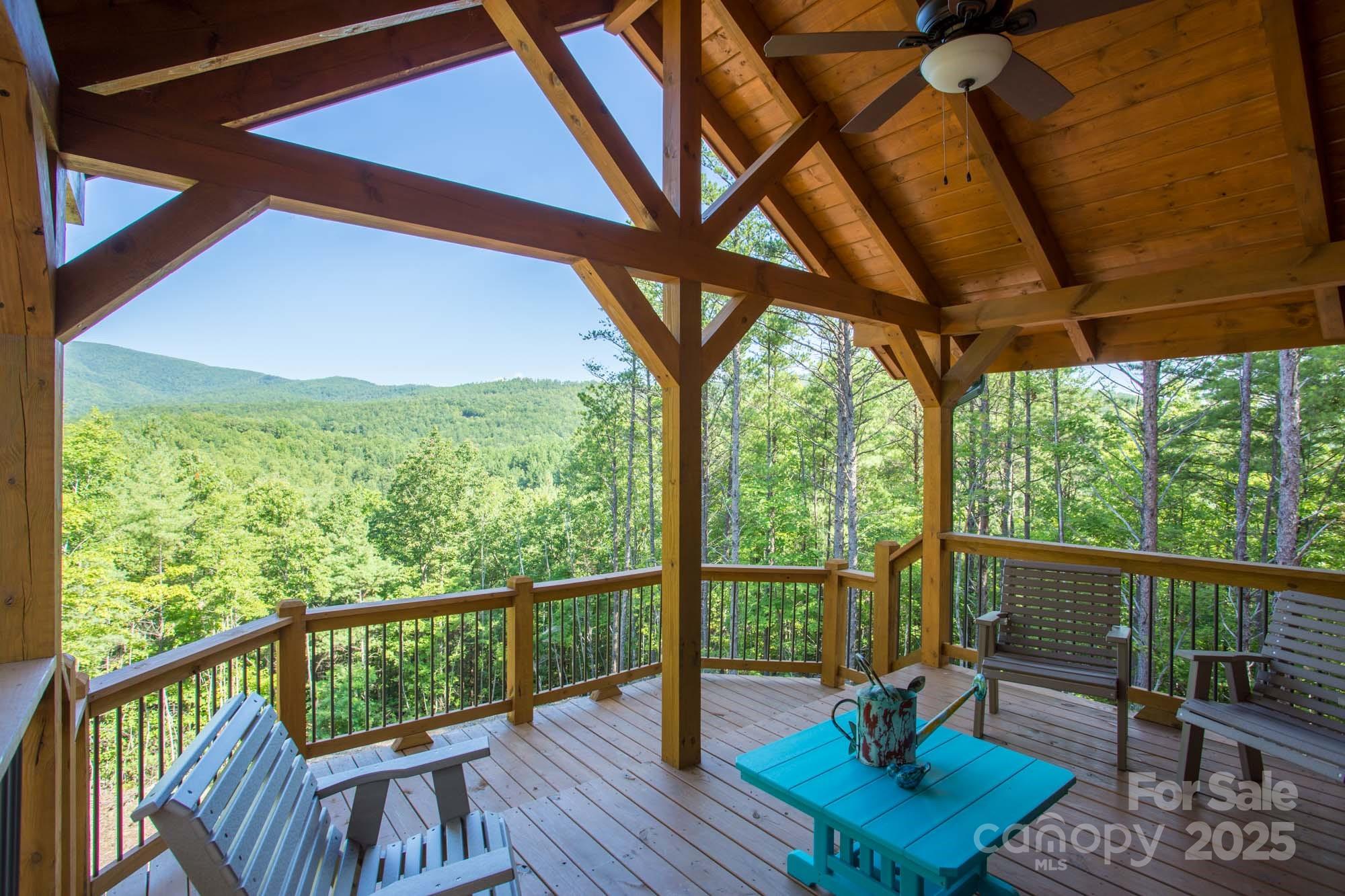 9587 Shortoff View Terrace, Unit 57 Nebo, NC 28761 - Photo 12 of 16 a view of a chair and table in the balcony