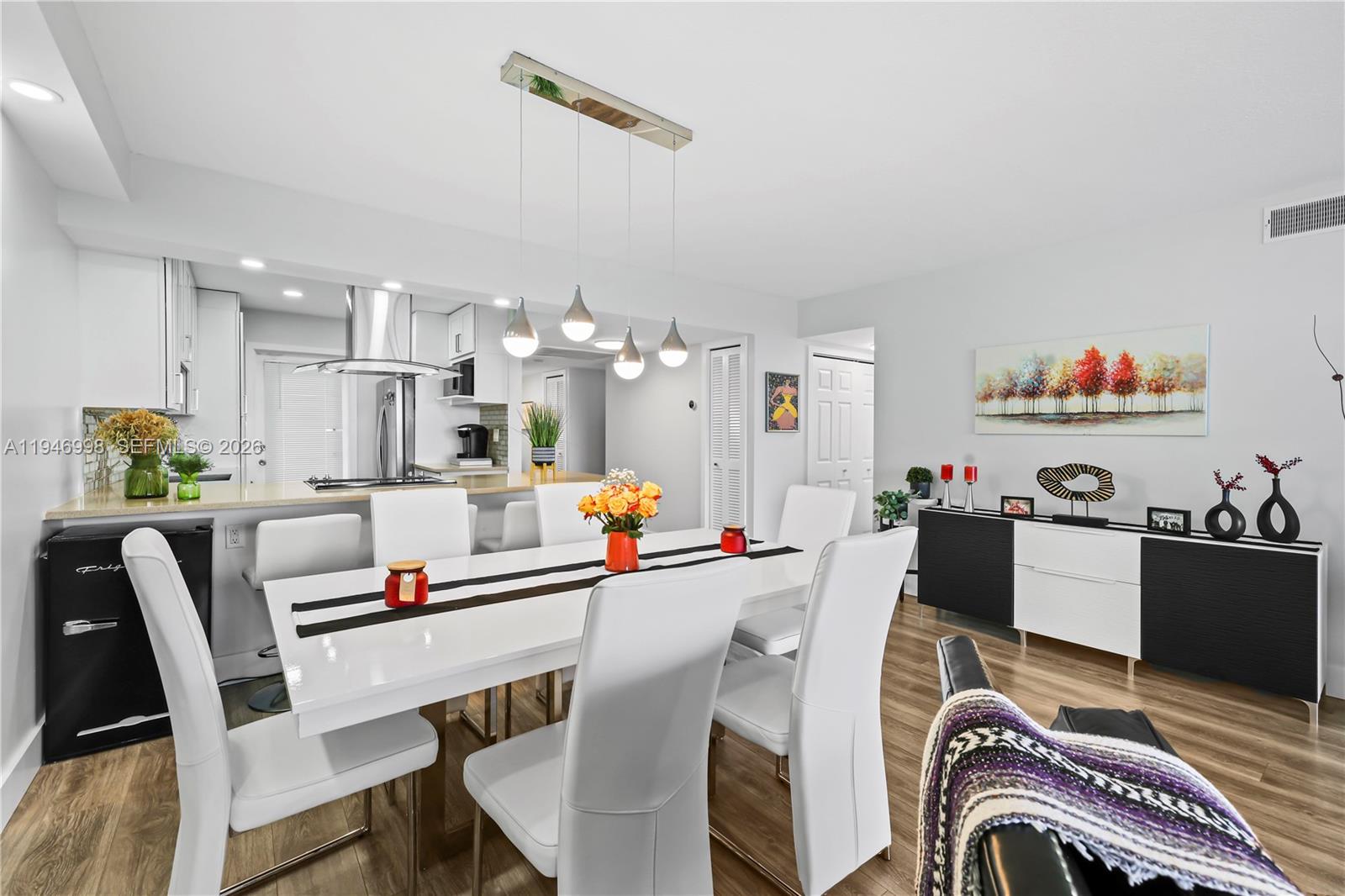 2661 South Course Drive, Unit 510 Pompano Beach, FL 33069 - Photo 11 of 49 a view of kitchen dining table and chairs