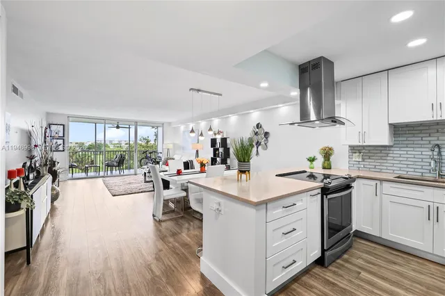 a kitchen with a sink stove and wooden cabinets