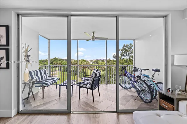 a view of a balcony with furniture