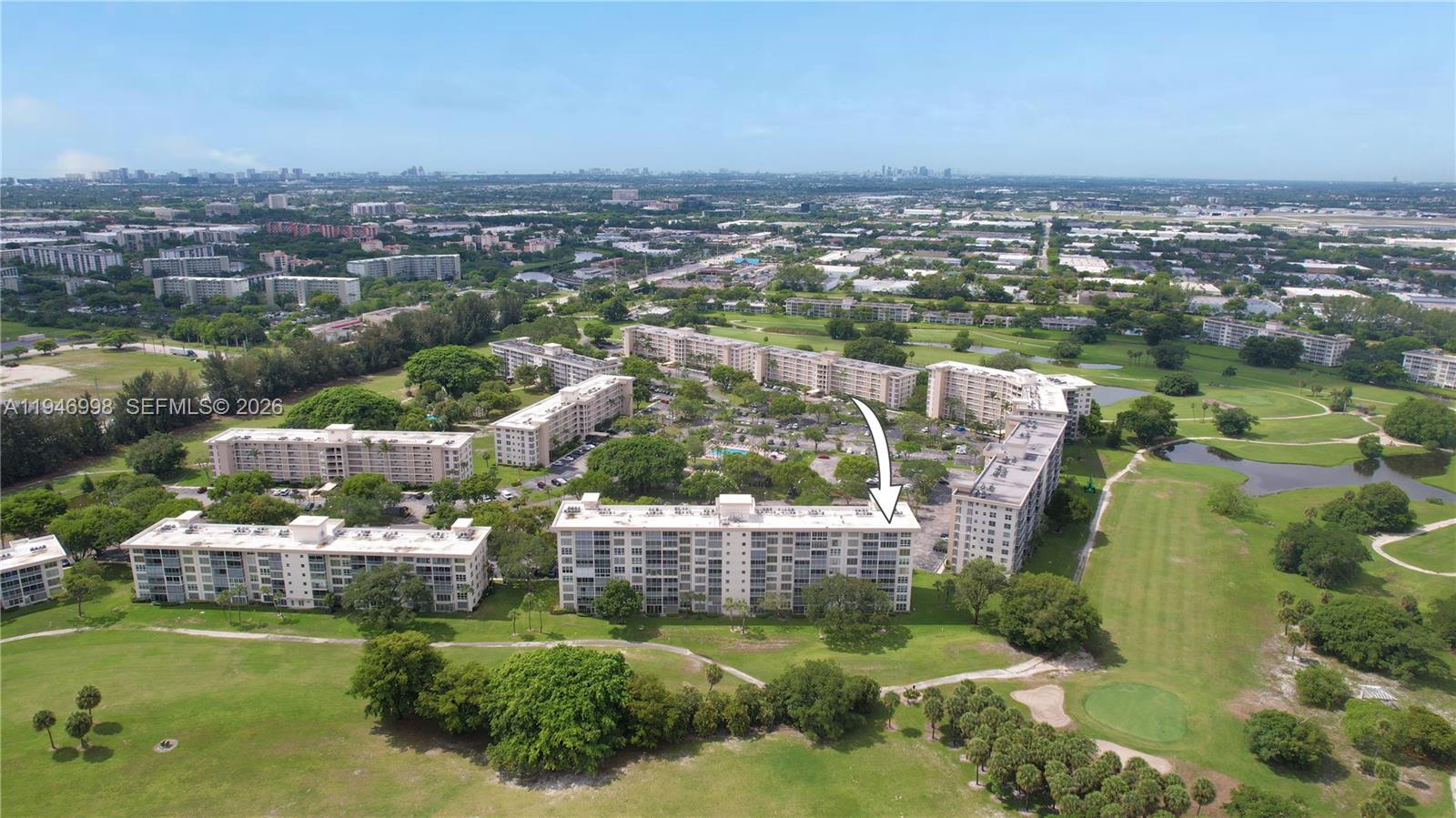 2661 South Course Drive, Unit 510 Pompano Beach, FL 33069 - Photo 36 of 49 an aerial view of residential houses with outdoor space and lake view