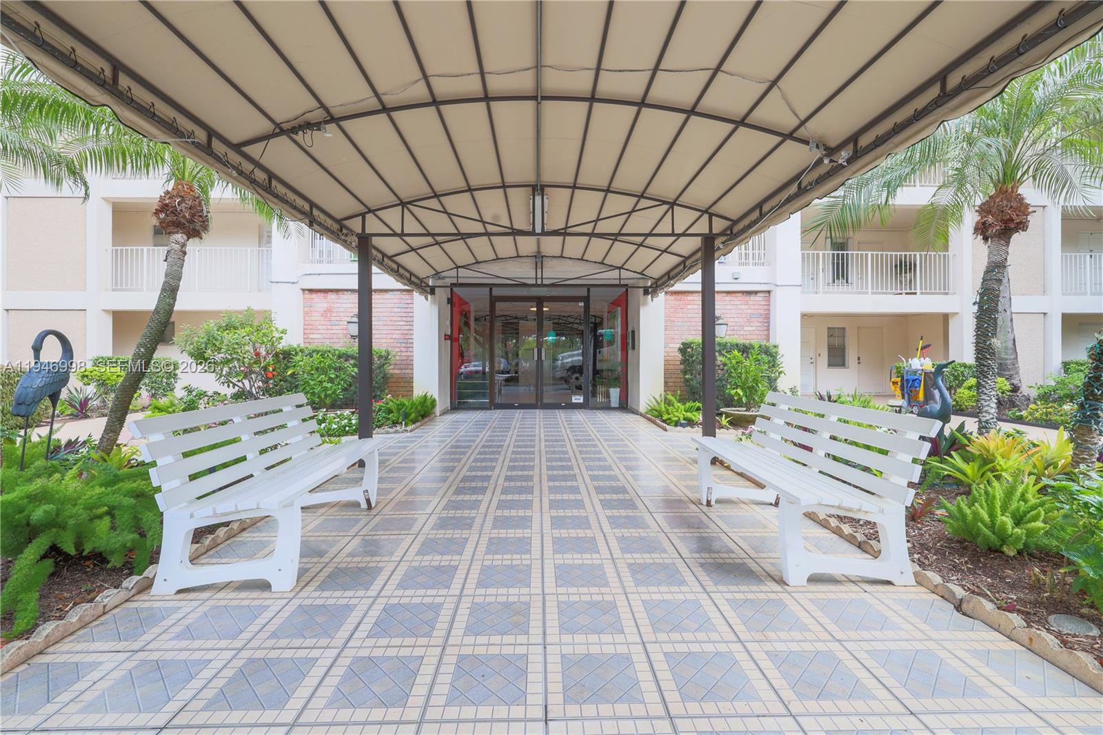 2661 South Course Drive, Unit 510 Pompano Beach, FL 33069 - Photo 40 of 49 a house view with a outdoor space