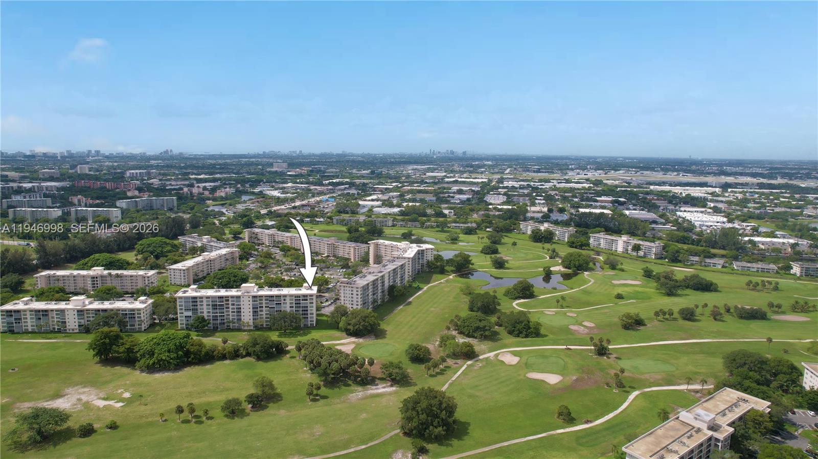 2661 South Course Drive, Unit 510 Pompano Beach, FL 33069 - Photo 49 of 49 an aerial view of residential houses with outdoor space and trees