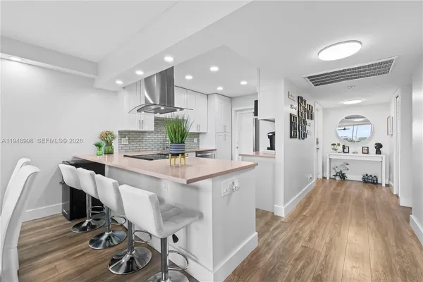 a living room filled with furniture and a table