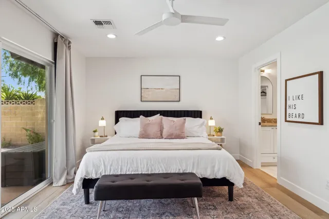 a view of a kitchen counter top space with sink a stove and living room view
