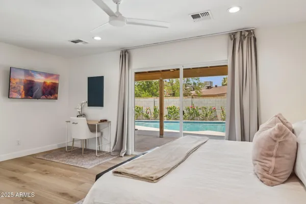 a bedroom with a bed and a window