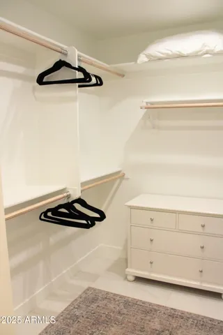 a view of storage and utility room with racks on the wall