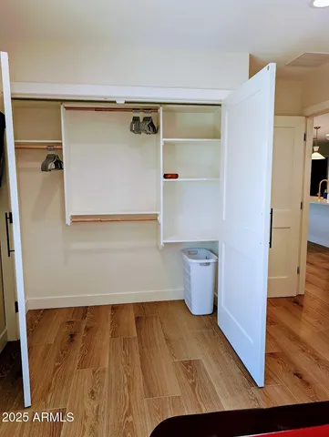 a bedroom with a large bed and a large window