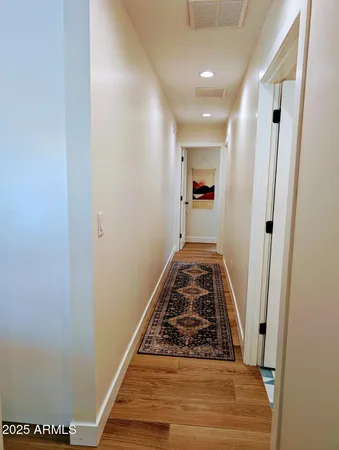 a bathroom with a checkered floor and a shower curtain