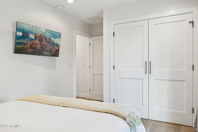 a bedroom with a bed and a lamp